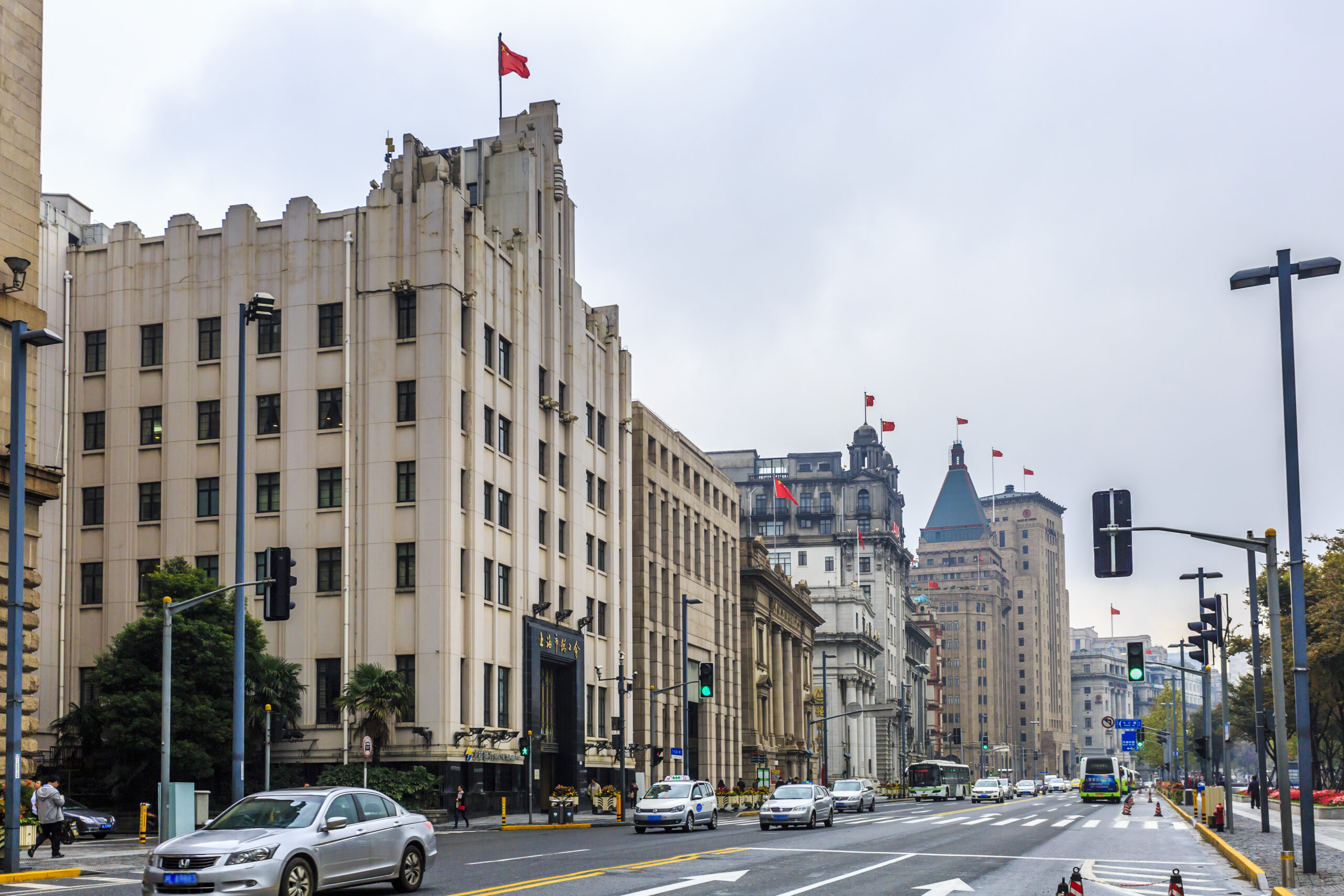 Street view of a bustling city in Canada with historical architecture and modern vehicles, illustrating the urban environment and cost of living factors.