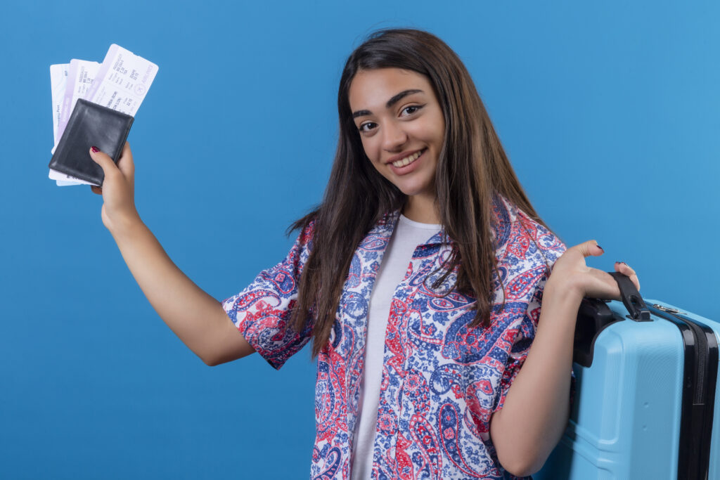 tourist-woman-holding-travel-suitcase-passport-with-tickets-with-smile