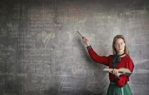 Woman in red dress teaching design concepts on chalkboard