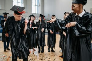 Excited graduating students celebrating with confetti
