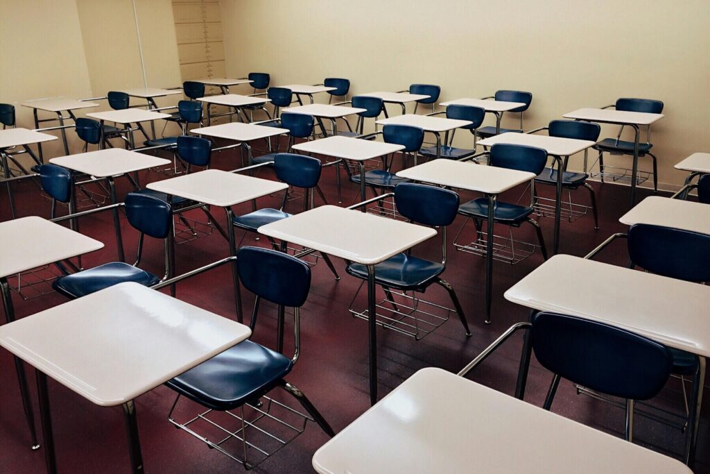 Empty classroom desks and chairs ready for students
