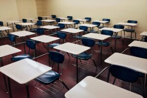 Empty classroom desks and chairs ready for students